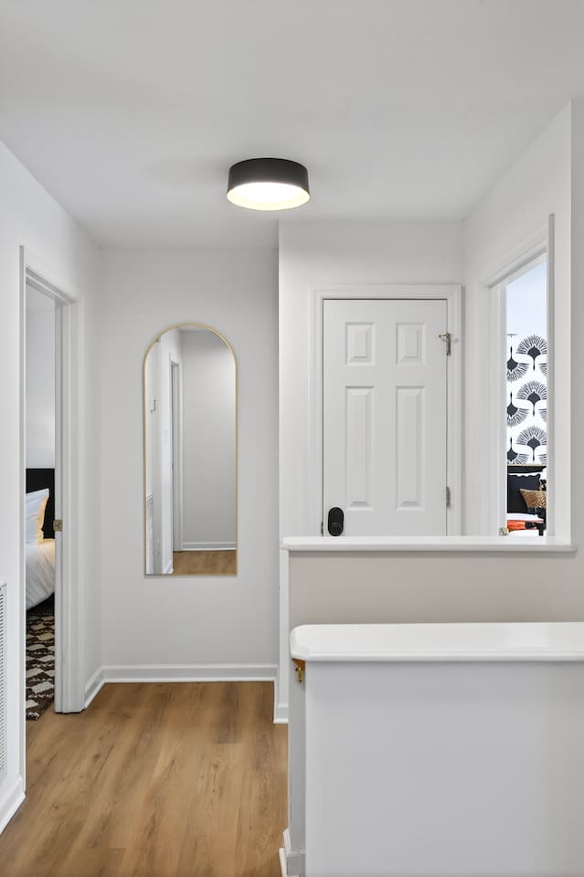 Multiple full length mirrors through out the house .