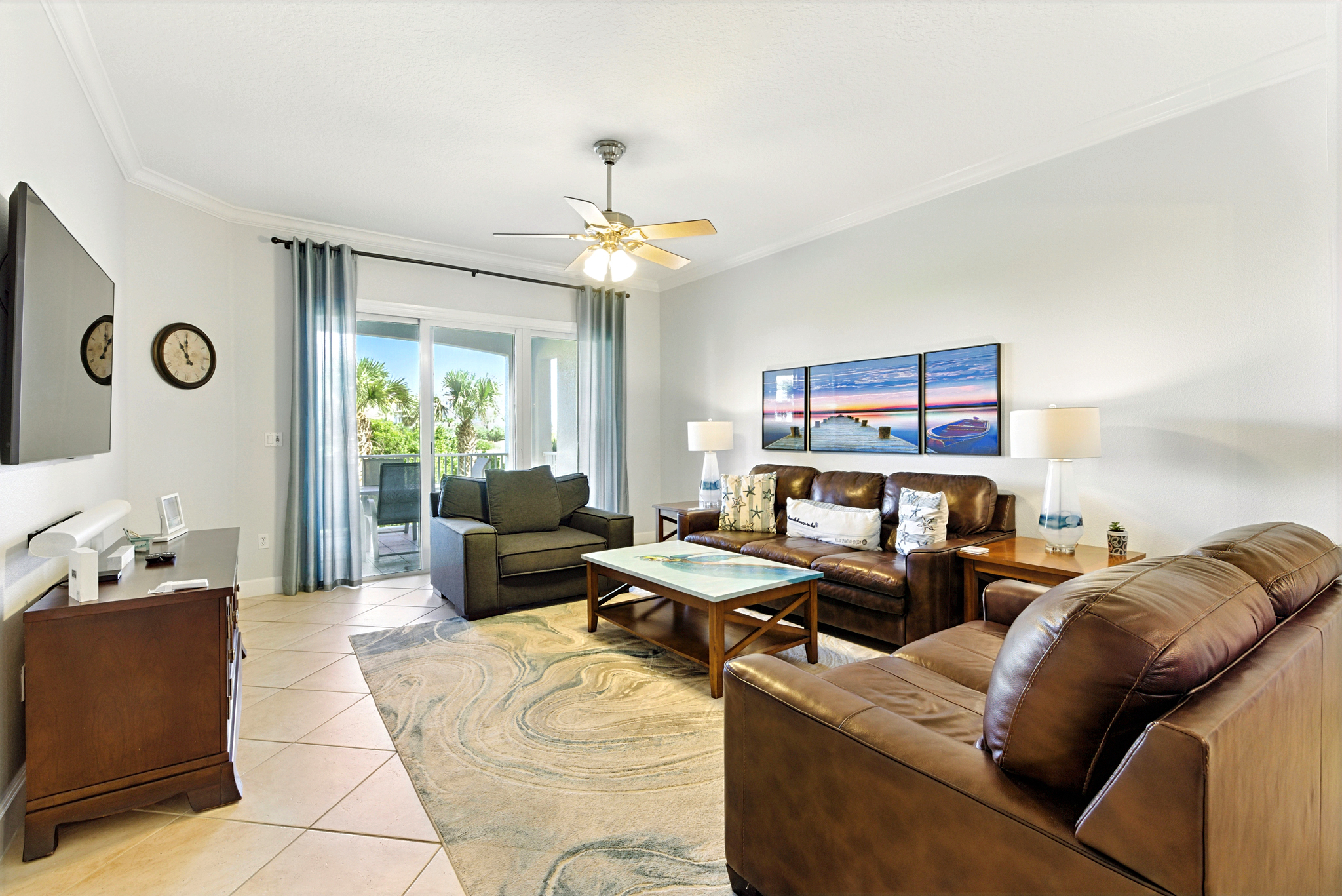 🛋️🌴 Bright, breezy, and built for relaxing—kick back on the comfy leather sofas, stream your favorites on the big TV, and let the coastal vibes flow in from the private balcony. 📺✨
