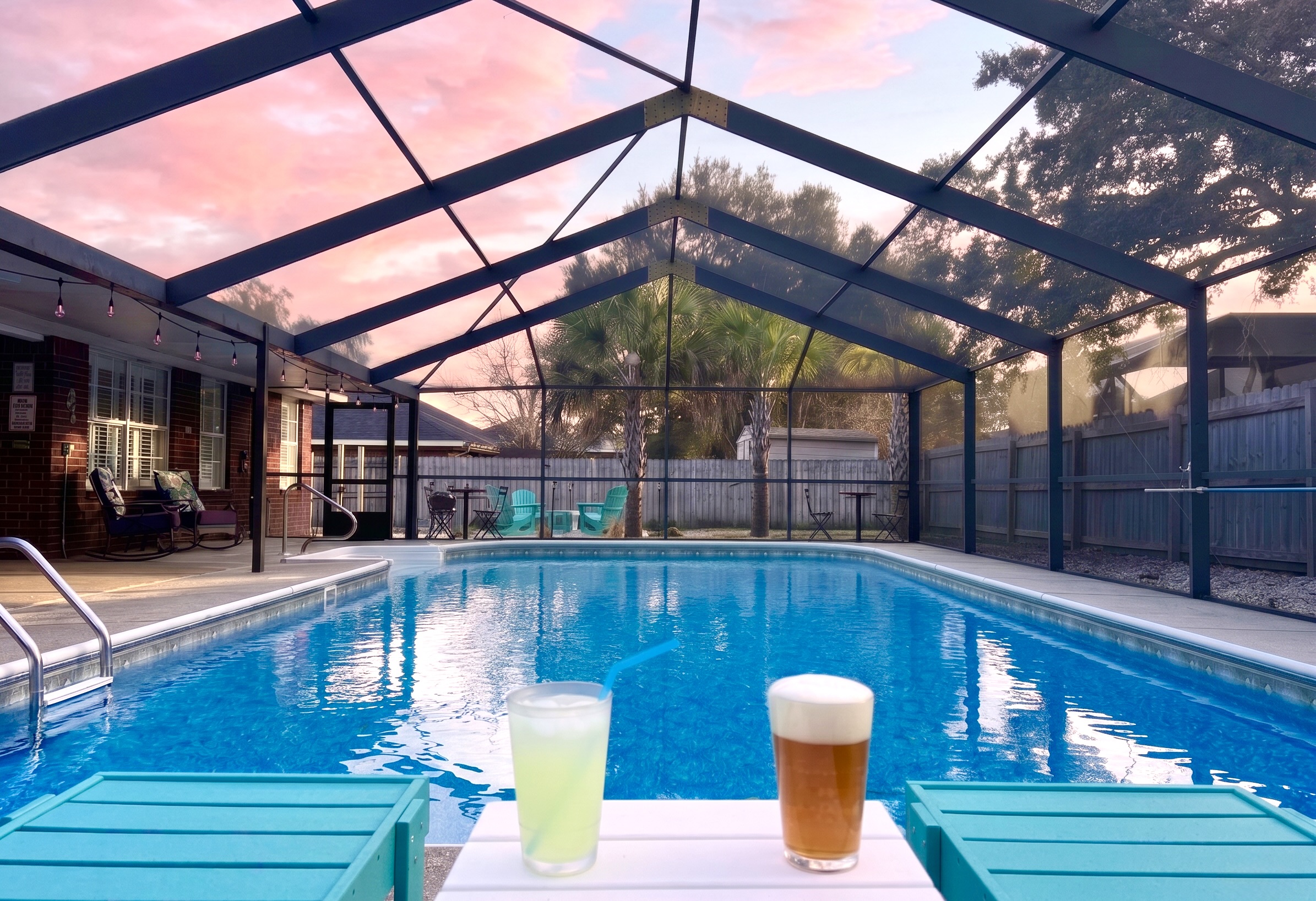 Relax and soak up the sunsets with a cold beverages in Polywood chaise lounges next to the gorgeous, screened-in, and the heated (year round) pool. Cheers!!