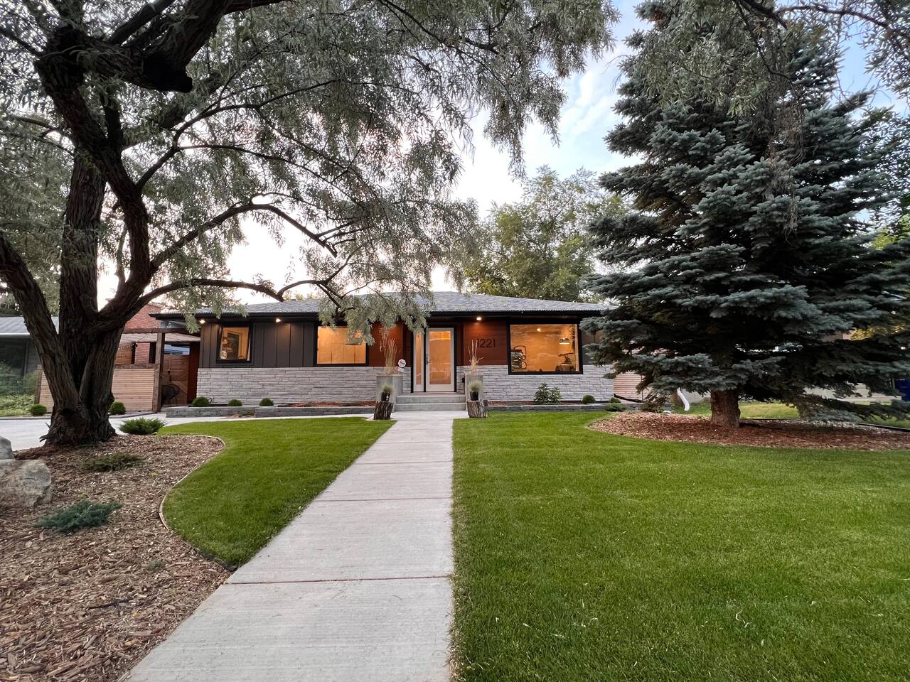 Exterior of the home — the guest suite entrance is through the pergola on the left.