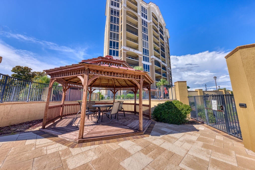 Gated rear courtyard/pool area with gazebo