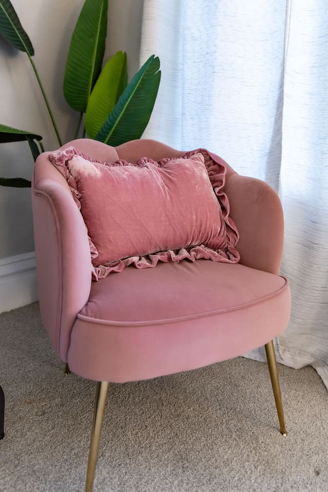 The side chair by a window in the King Bedroom provides a peaceful moment.