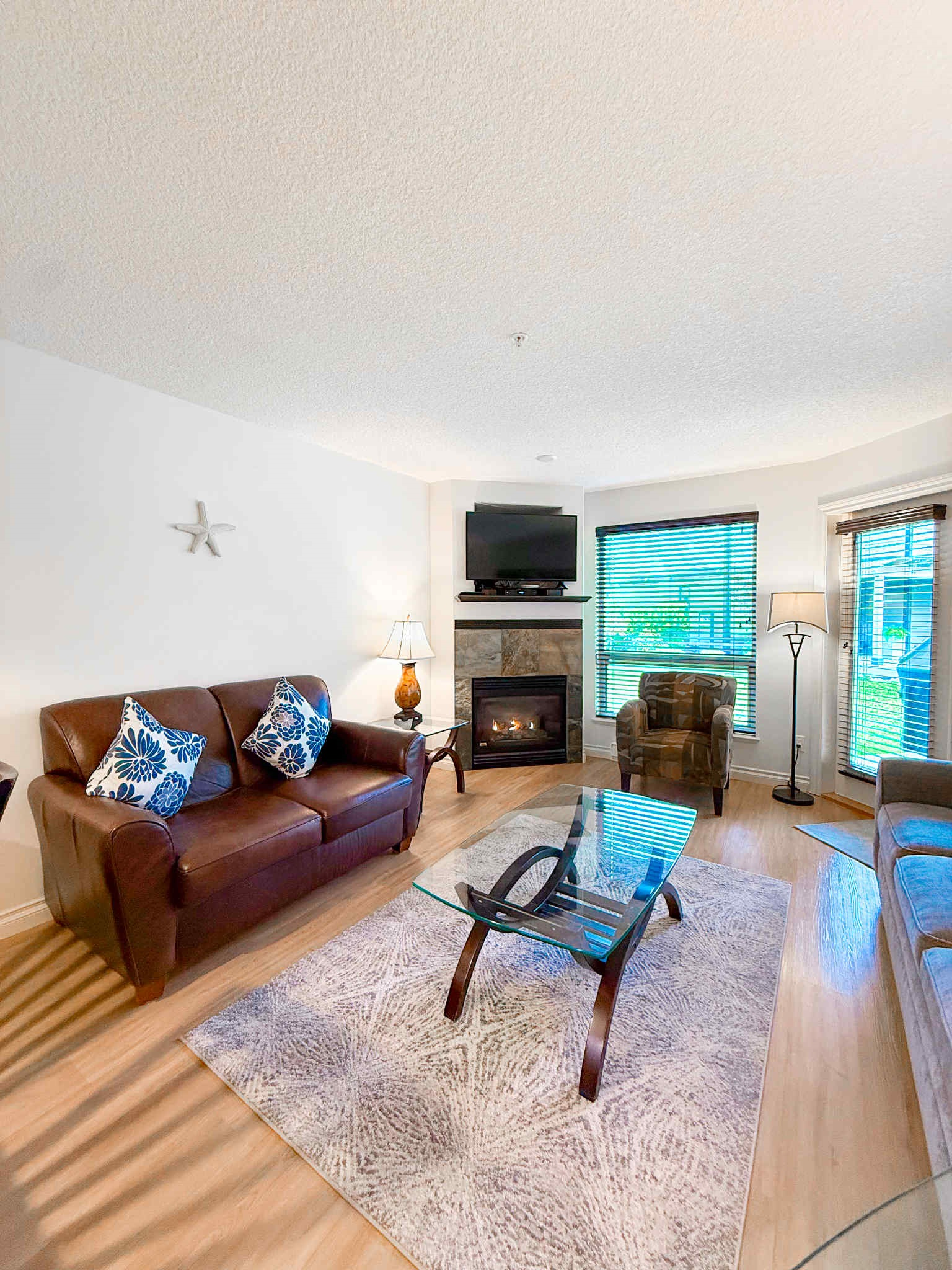 Unit A Living room area. Natural gas fireplace. Streaming TV. Double glass doors to private covered patio.