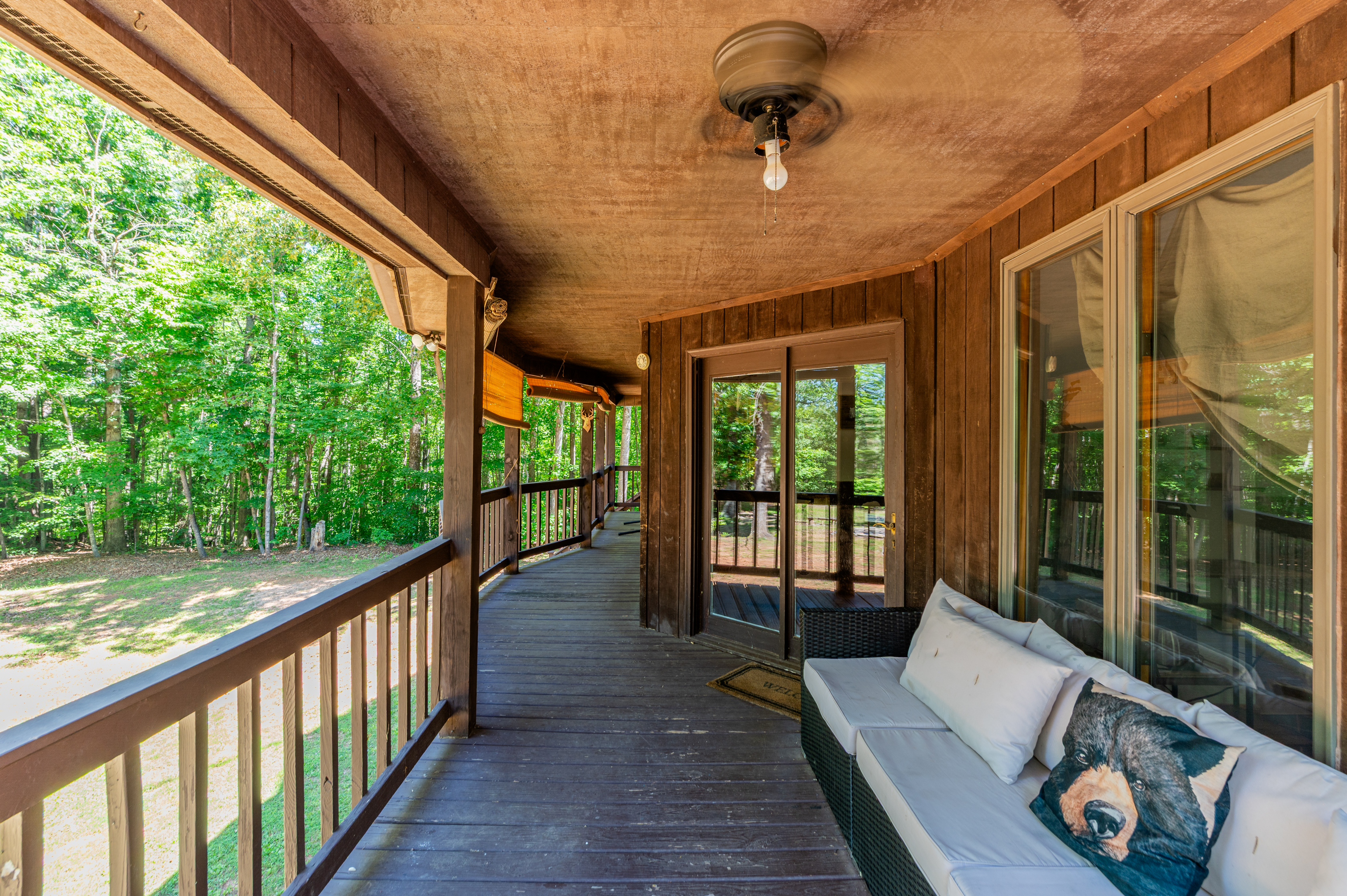 Spacious Porch: Relax on the wraparound porch surrounded by lush greenery and fresh air!