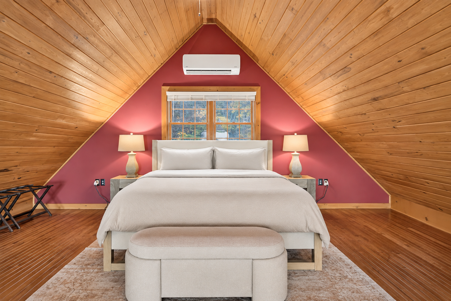 Loft bedroom with vaulted wooden ceiling
