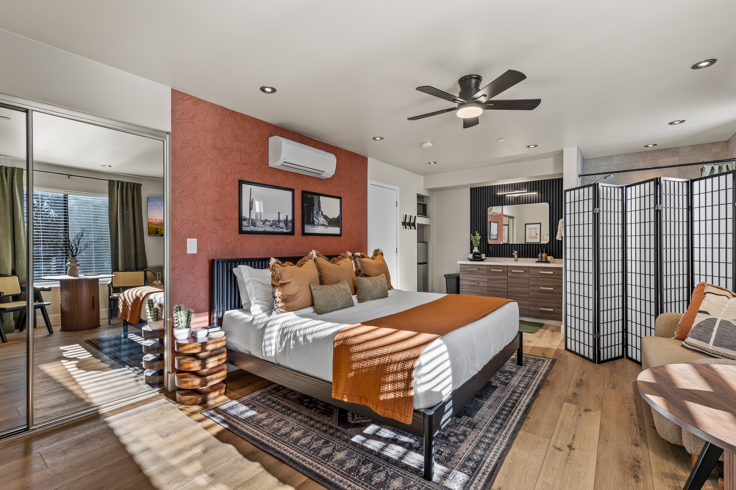 A serene, design-forward guesthouse suite with a king bed, spa-style bathroom, and private entrance, perfect for couples or added privacy within the property.