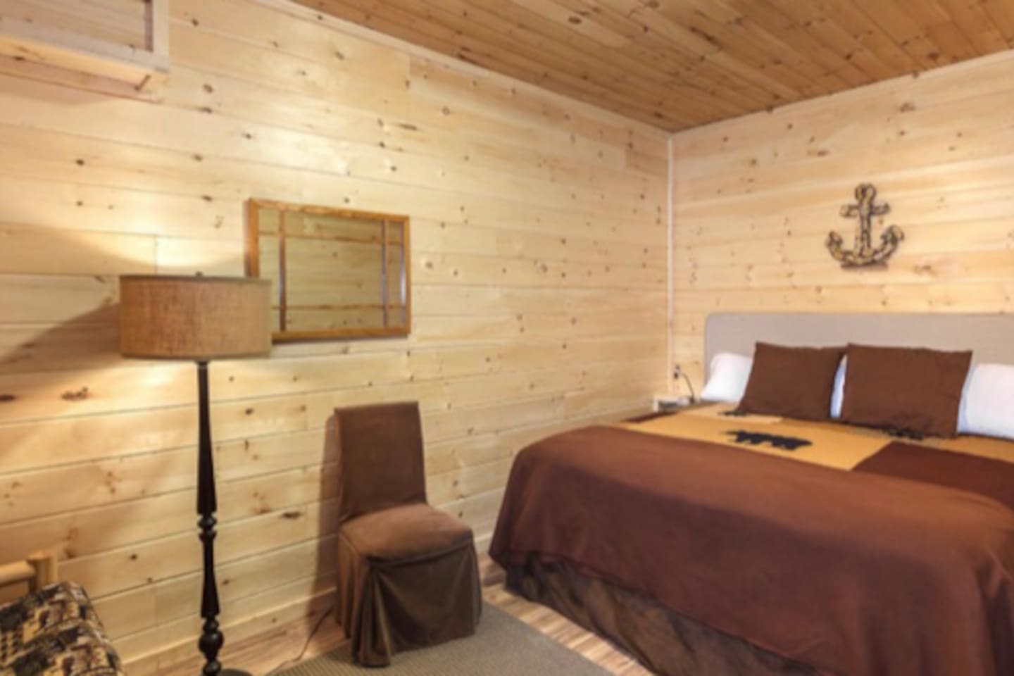 Lower level King size bed with futon sleeper.