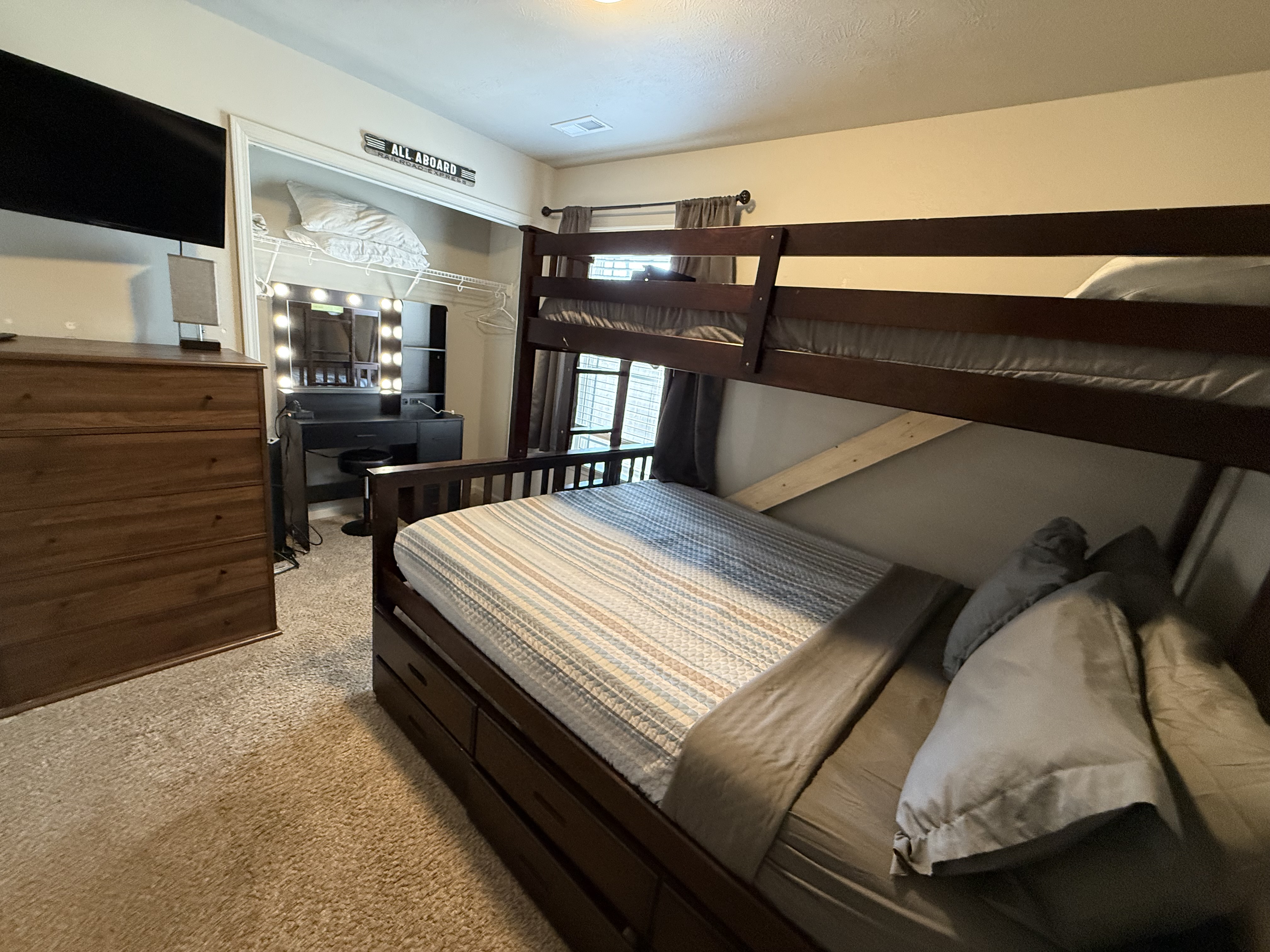 Bedroom 3 has a makeup area and room to easily sleep 3 guests