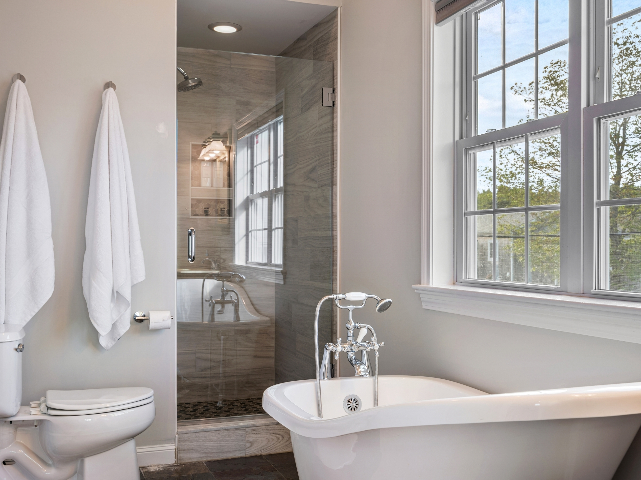 Relax and rejuvenate in your ensuite bathroom, where a beautiful bathtub  and shower invites you to unwind!