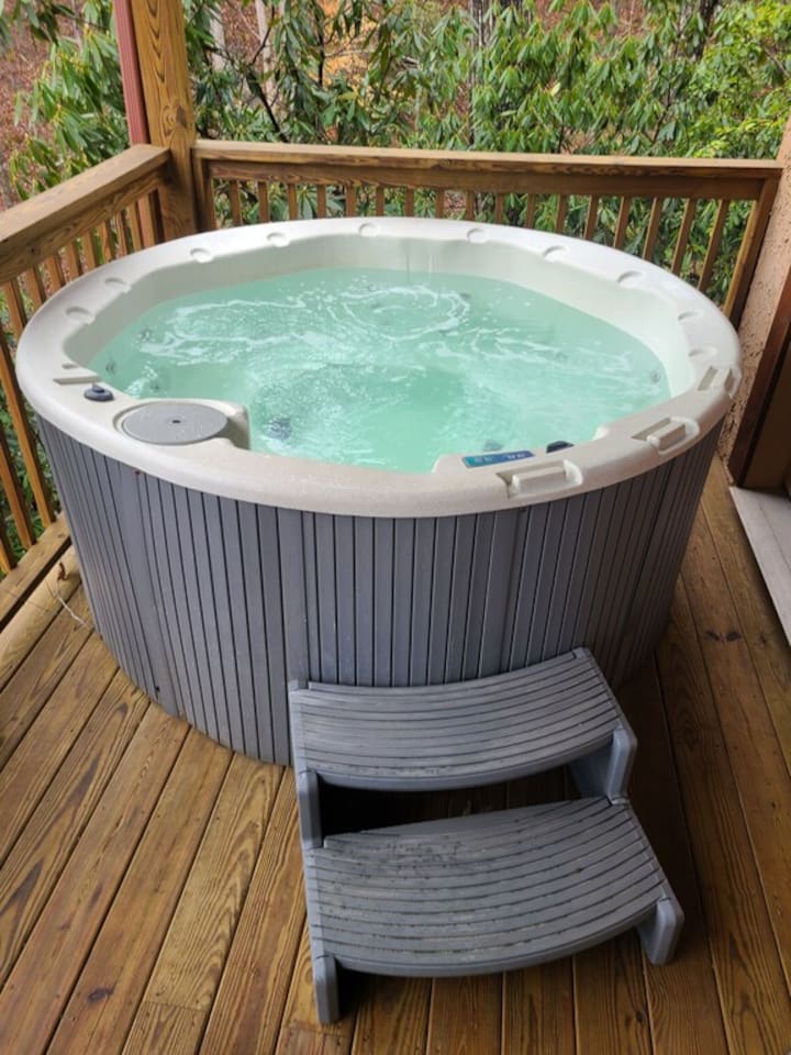 Hot tub located on lower level of cabin