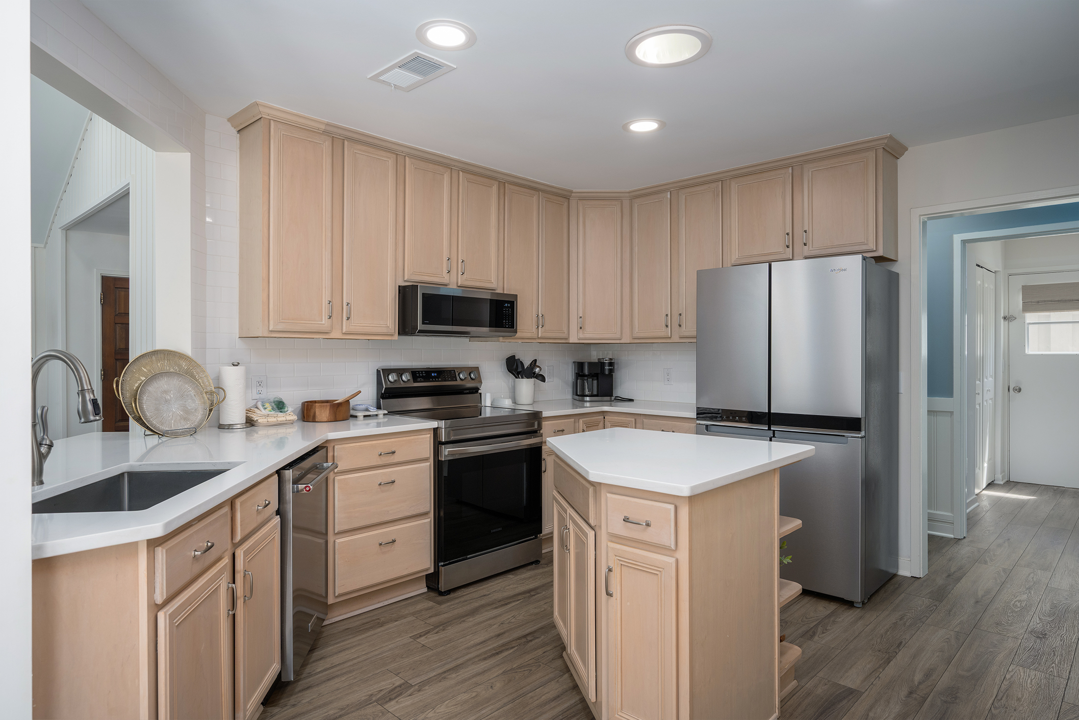 Kitchen opens into hallway to the bedrooms