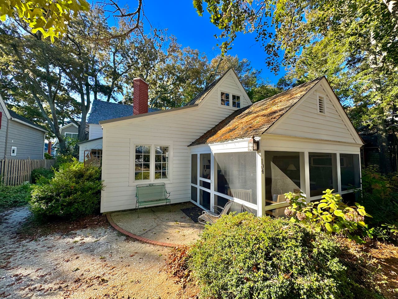 Front of the house, cozy screened in porch on a wooded quite lot 