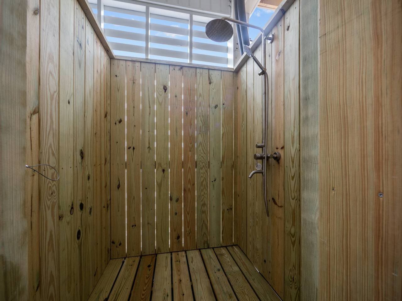 Outdoor Shower in parking area with hot/cold water