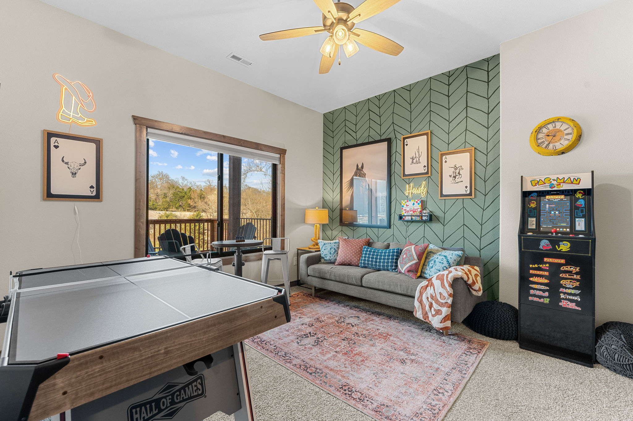 Challenge Friends to a game of ping pong, then relax on the comfy couch in this bright, stylish space- complete with arcade games and balcony access for fresh Ozark air. Perfect for family fun.