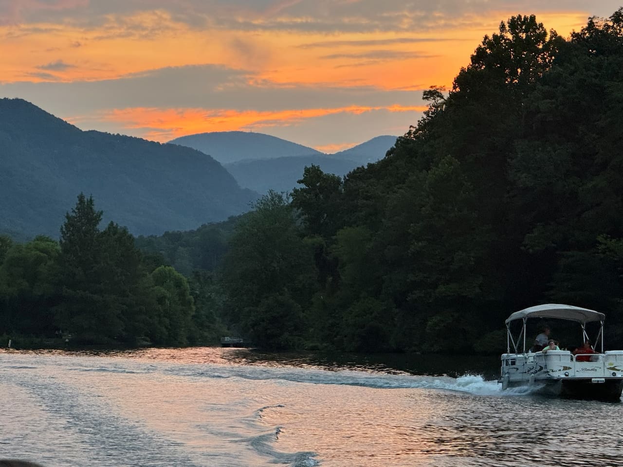 Boating on beautiful Lake Lure. Pontoon boats available for rent.