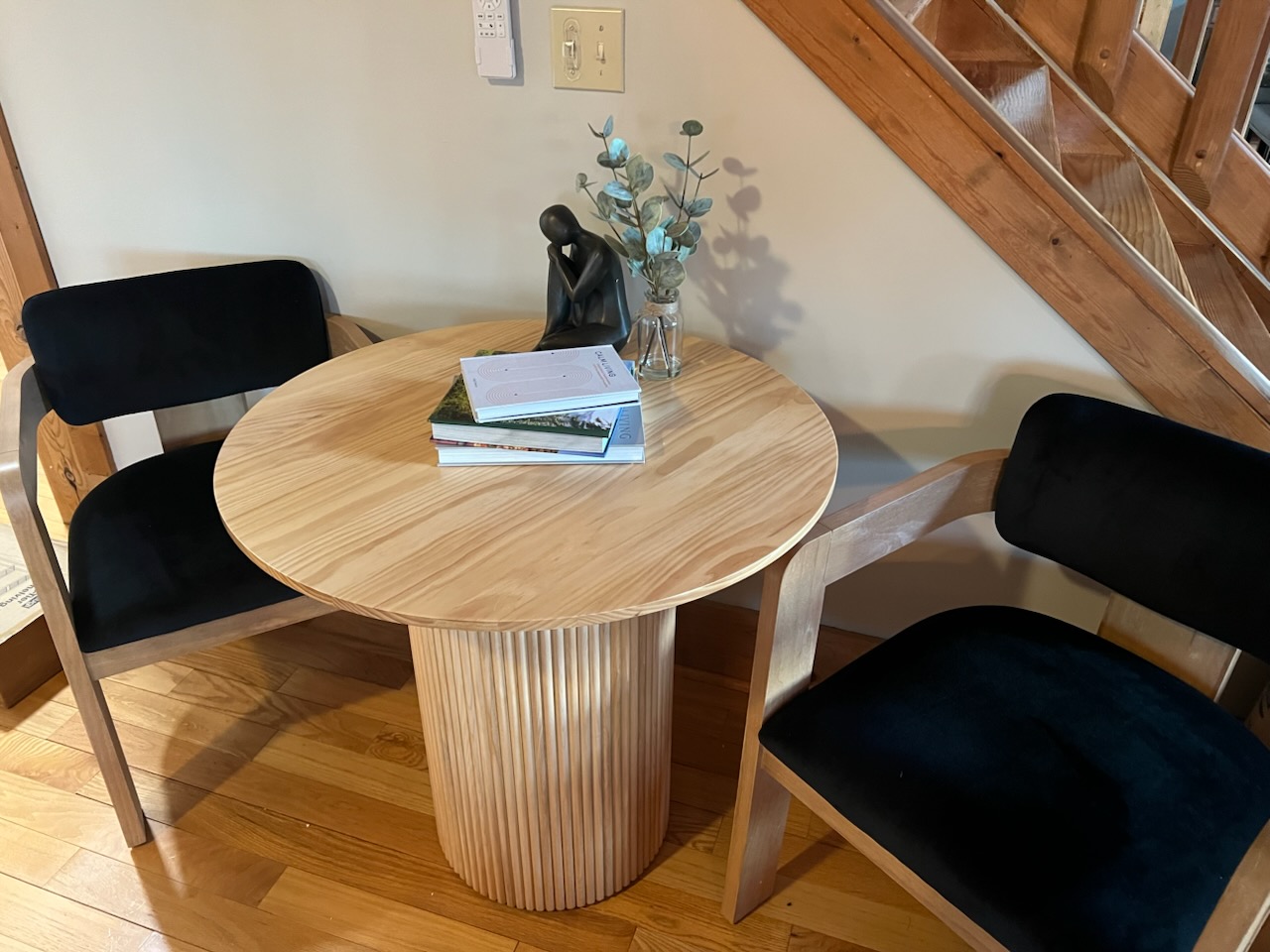 This cozy corner table offers a peaceful spot for morning coffee, quiet conversation, or planning your next adventure in comfort and style.