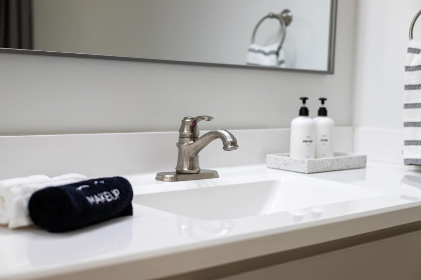 Fresh towels and essentials are thoughtfully provided for your comfort at the bathroom sink.