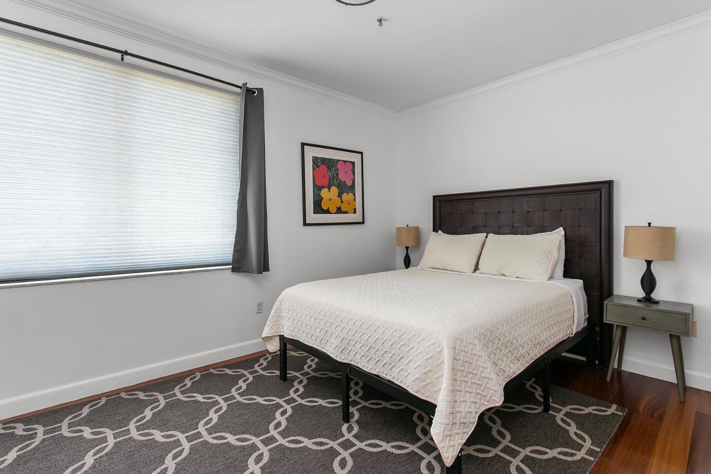 Guest Suite with en-suite bath, closet storage, and room-darkening curtains
