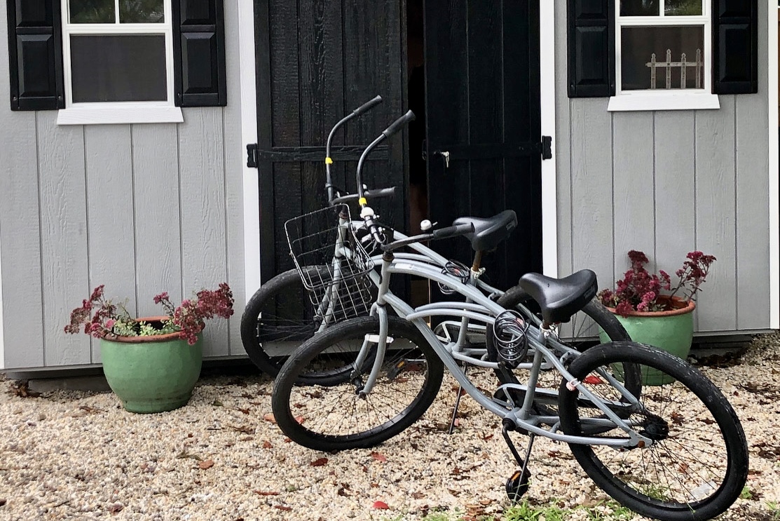 two beach cruisers with helmets and locks are in the shed for you, along with beach chairs and a beach cart...some toys too