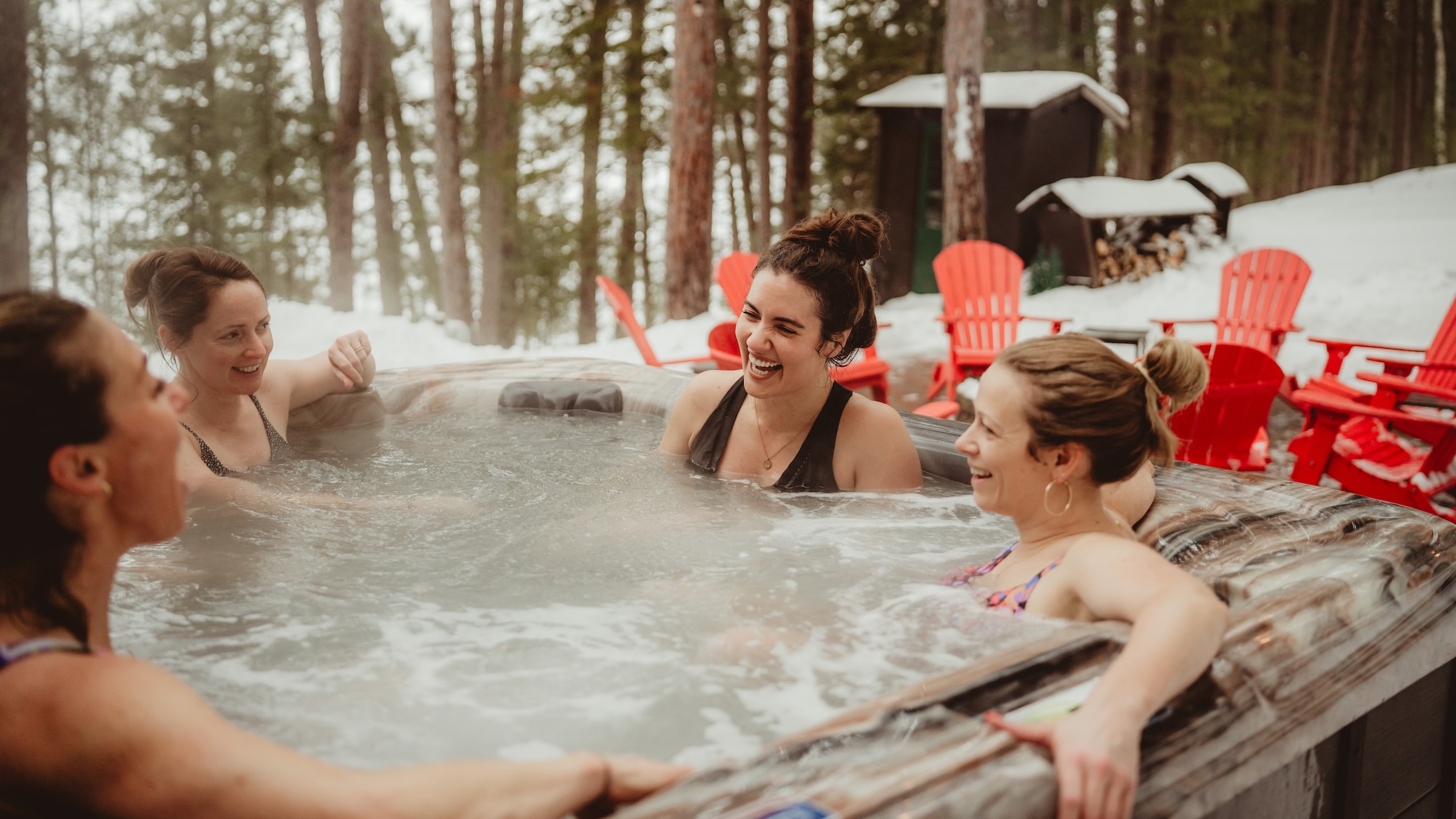 Girls Getaway enjoying outdoor hot tub at Dollar Lake Retreat