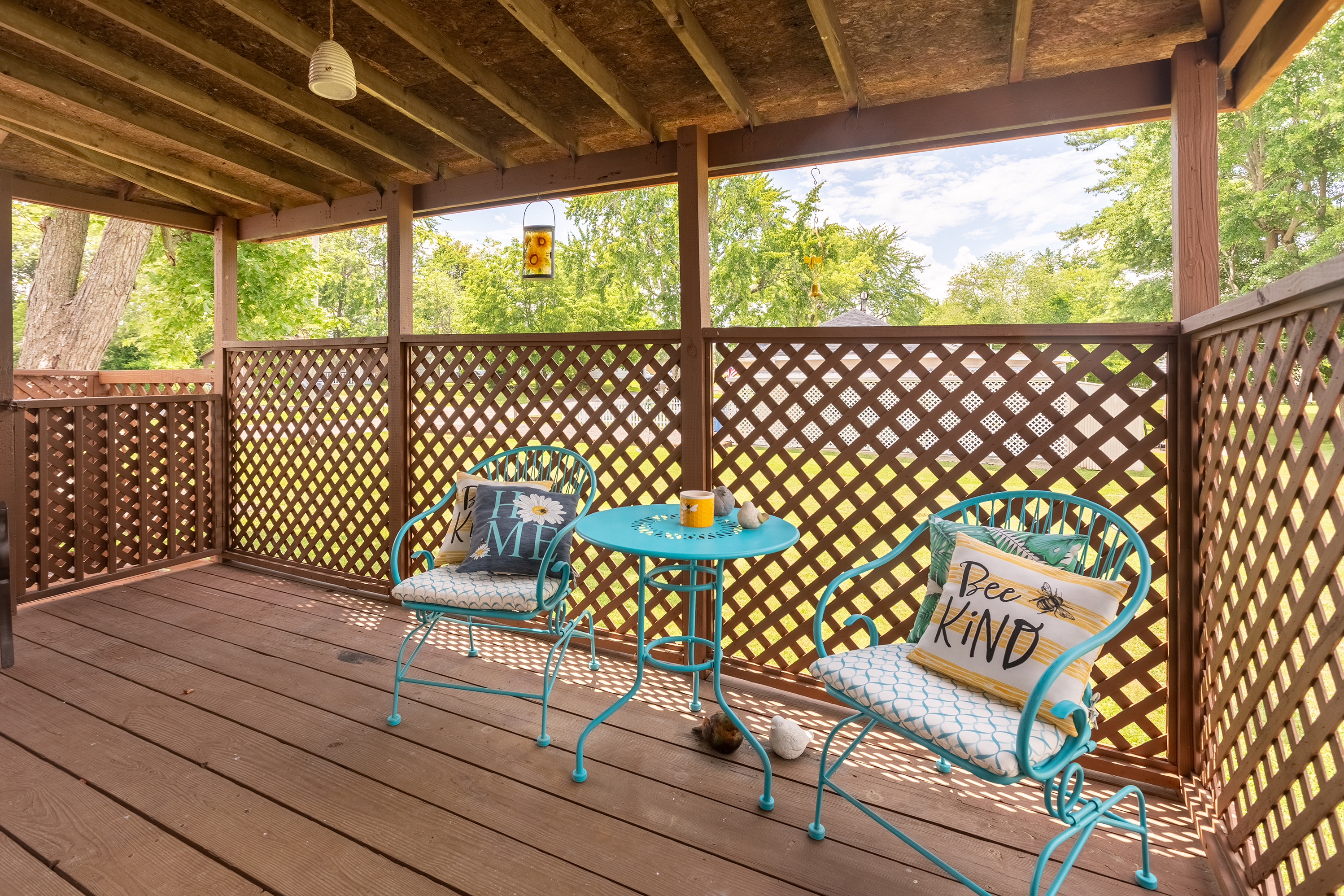 Your peaceful retreat. Sip, sit, and soak in the fresh air on the covered deck’s bistro set and metal bench.