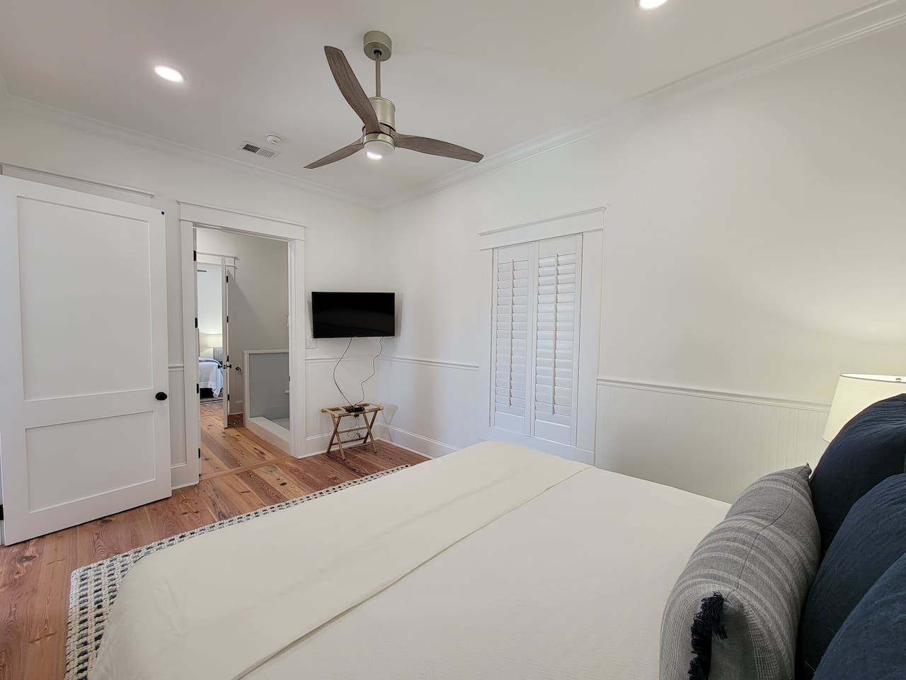 Master bedroom looking into shared bathroom.