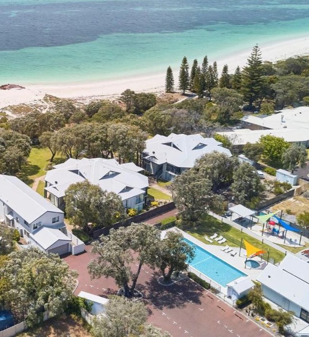 Birds eye view of pool area & playground within the complex