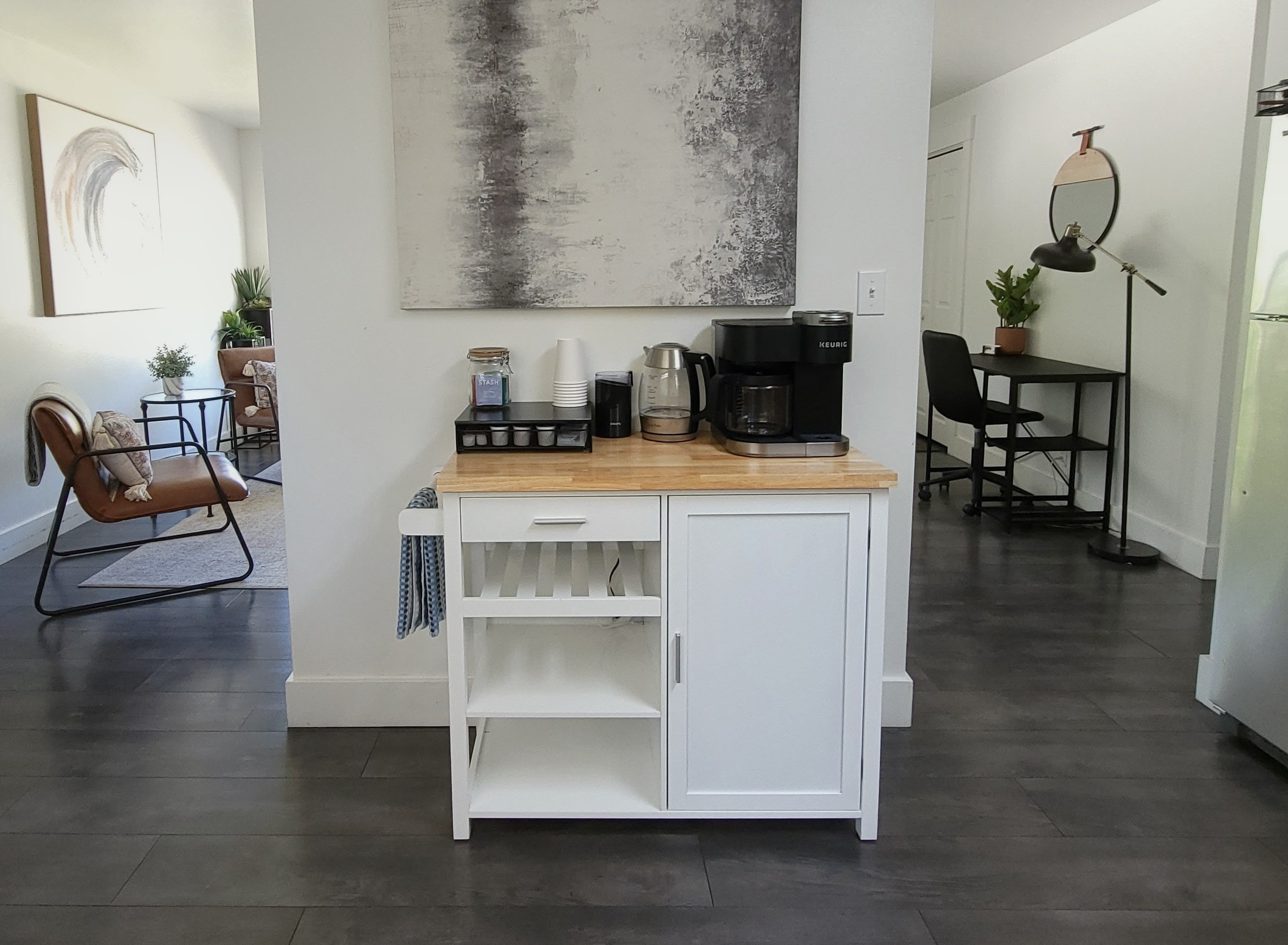 Coffee, tea, electric kettle, and coffee grinder. Extra storage for food in kitchen. 