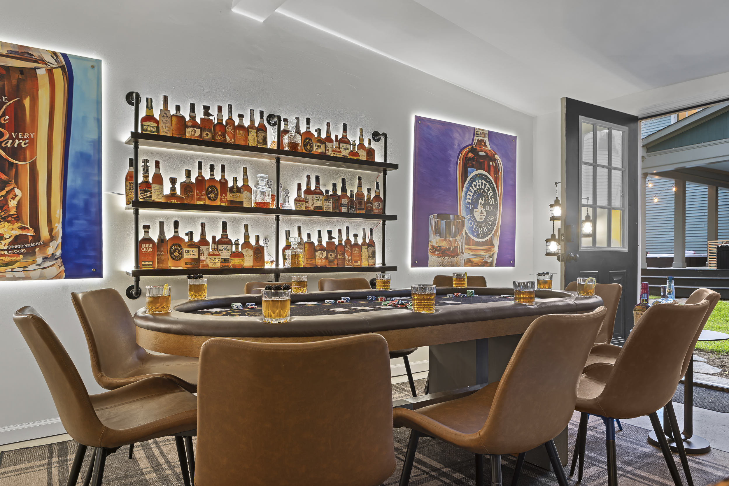 With eight leather chairs, a tournament table, and more than 60 bottles displayed on the wall, Rickhouse Run is built for memorable game nights.