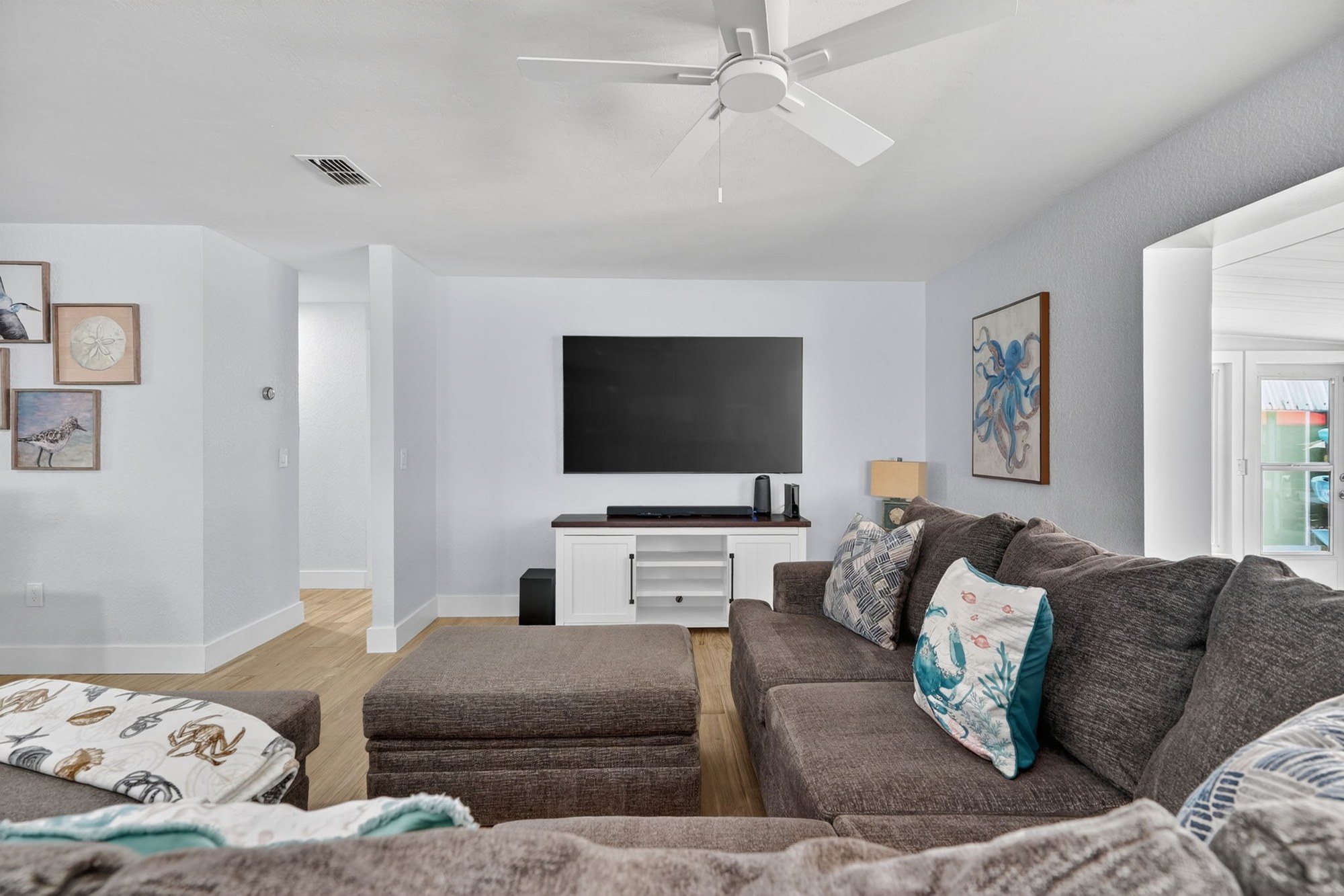 Living room with white brick fireplace