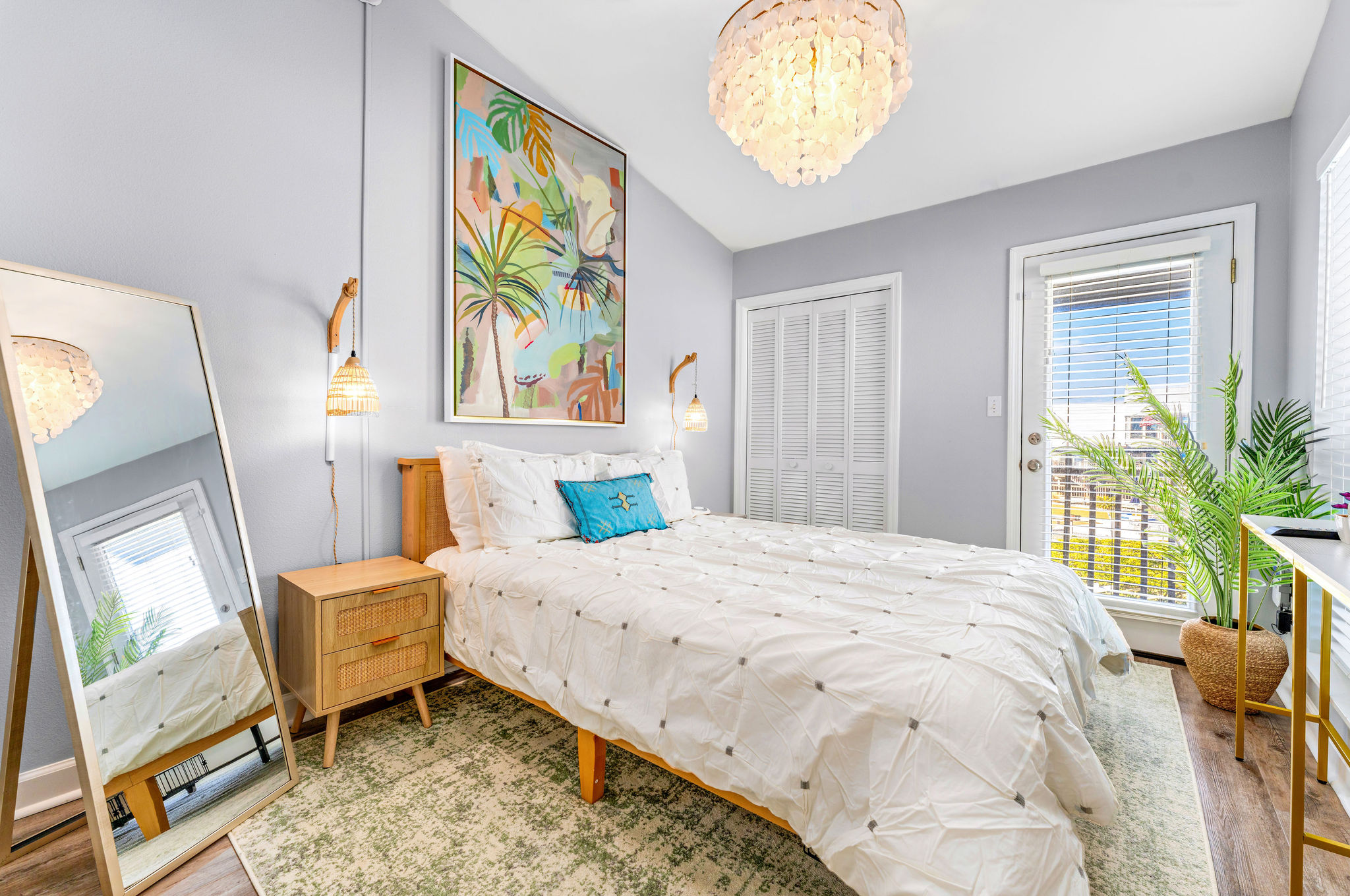 The guest bedroom features a smart TV and a comfortable Queen Zinus bed and is conveniently located next to a full bathroom.