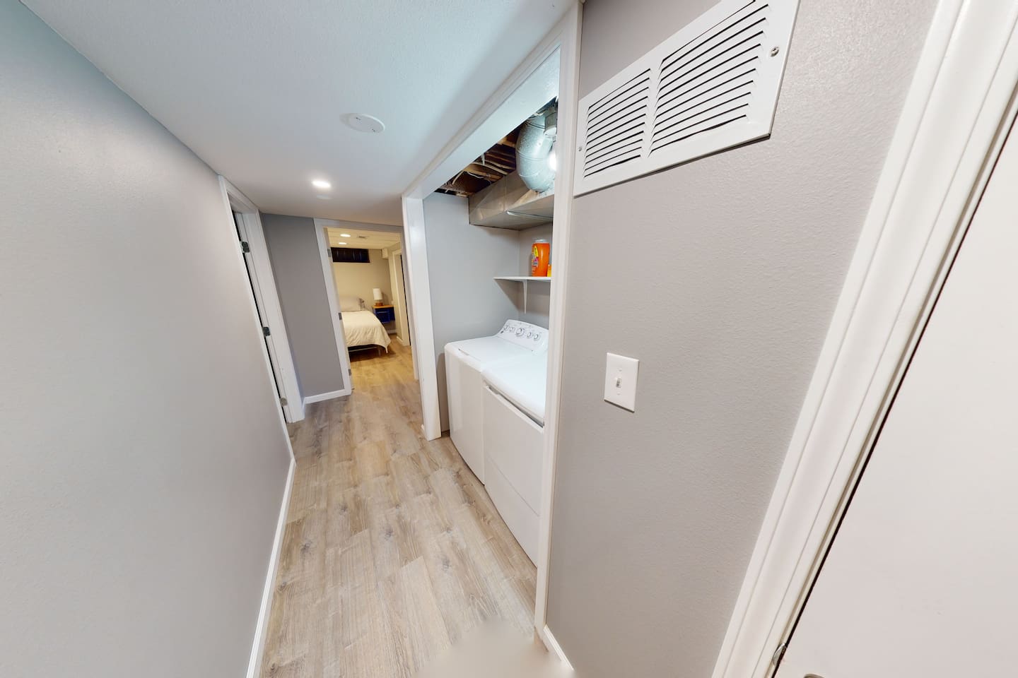 hallway in basement where W/D are located.  Bedroom # 4 is straight ahead and Bedroom #5 is to the left.
