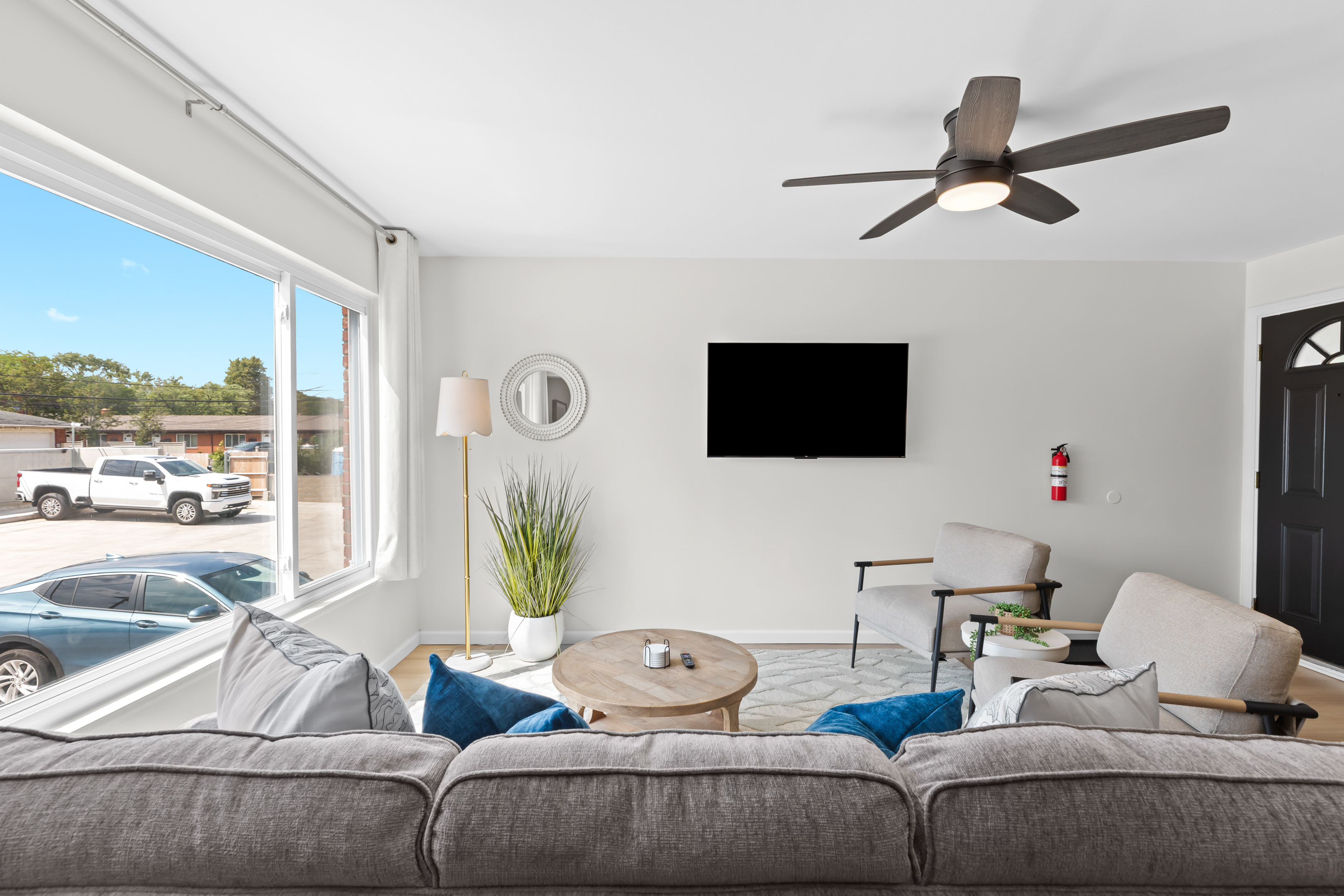 Cozy up on the sofa and enjoy your favorite shows in a light-filled living room.