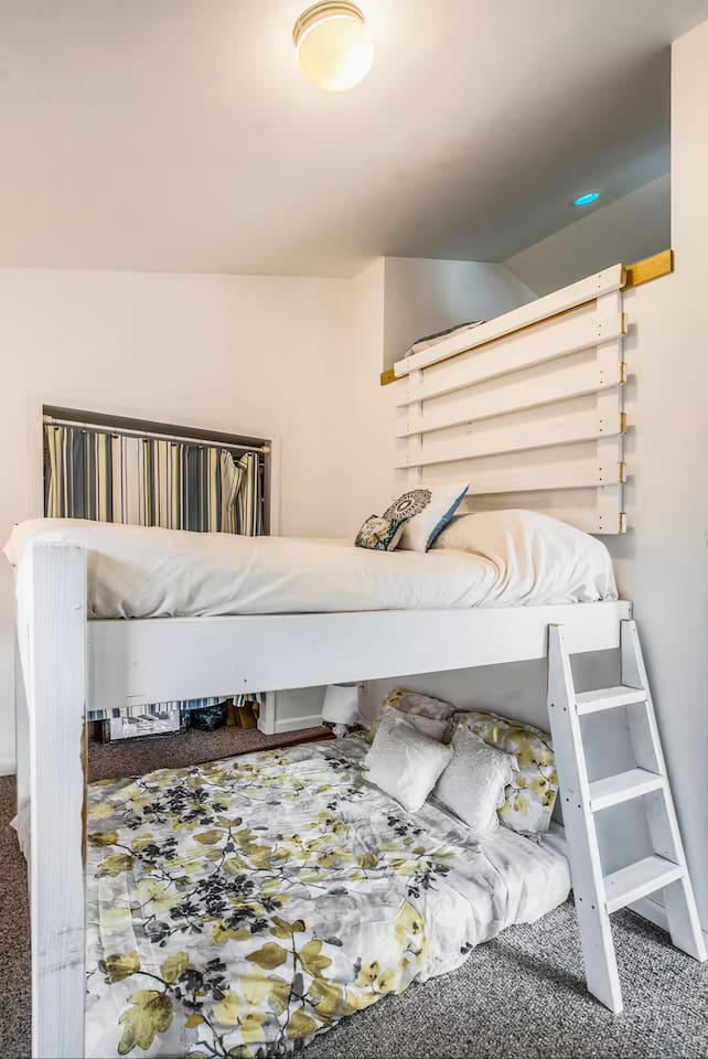 This bedroom is on the first floor of this Bi-level home. This offers a bunk queen bed with option of a loft with a twin bed (made for a child over 8 years old) or at your discretion.