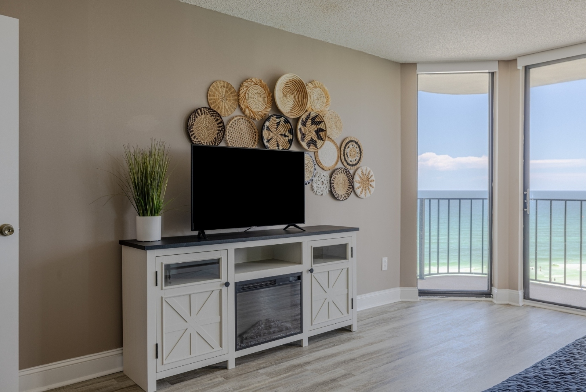 Master Bedroom #1 with smart TV and balcony access
