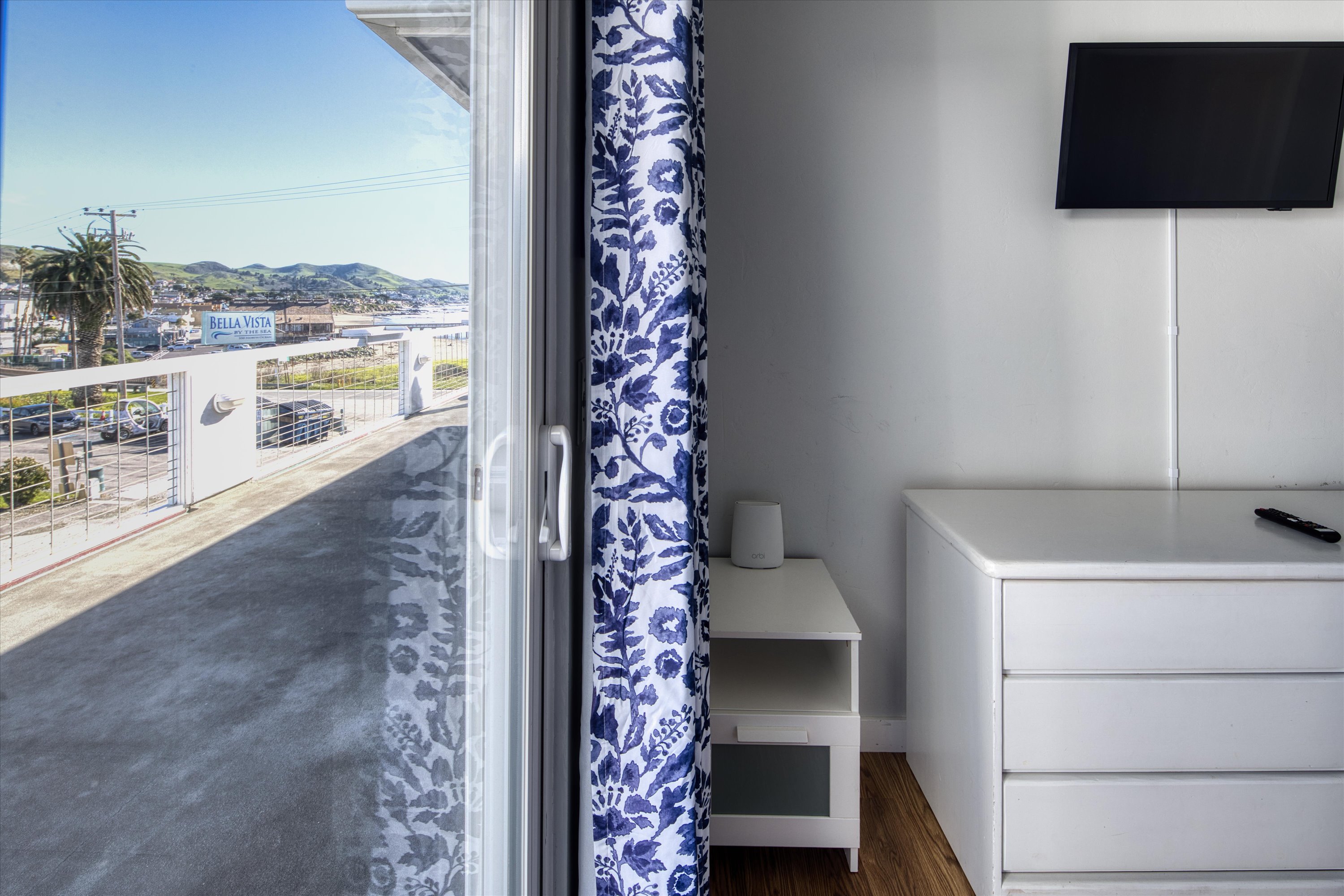 Curl up in this cozy bedroom with nature views and a big-screen TV for late-night unwinding.