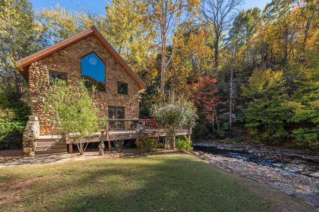 Stone Cottage may be right out of a fairytale, perfectly situated over beautiful Spring Creek in Hot Springs, NC
