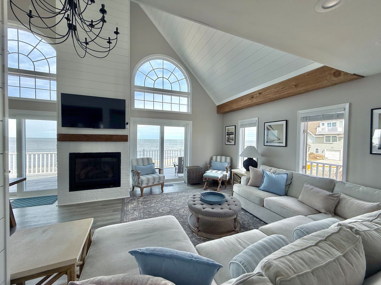 Sink into the plush comfort of this inviting lounge, perfectly positioned to capture breathtaking ocean views. With a cozy fireplace and serene atmosphere, it is the ultimate setting for families and friends to relax and cherish every moment of vacation.