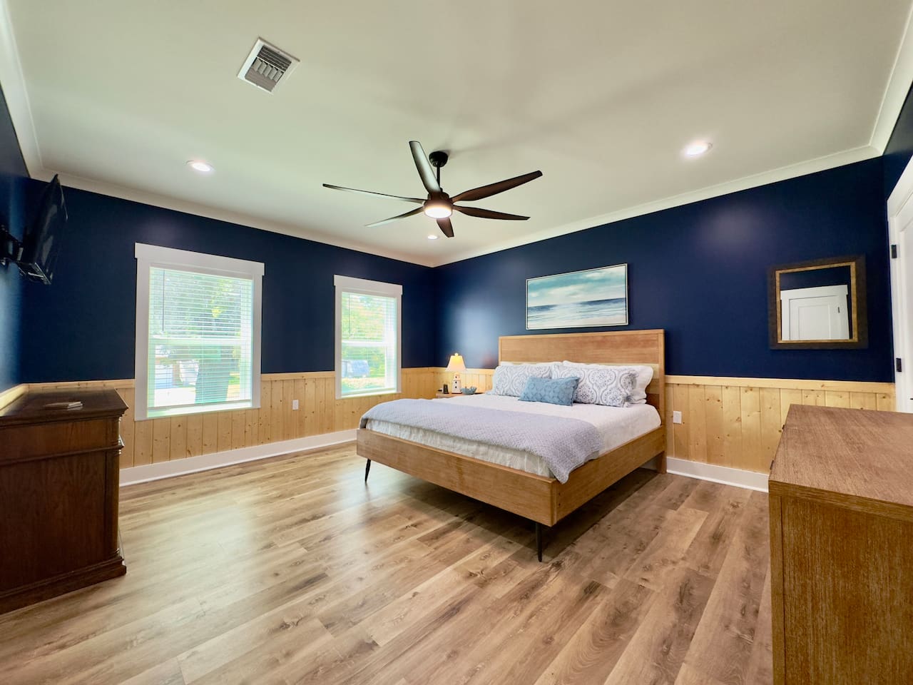 Enjoy a bright, airy bedroom with modern comfort and charm.