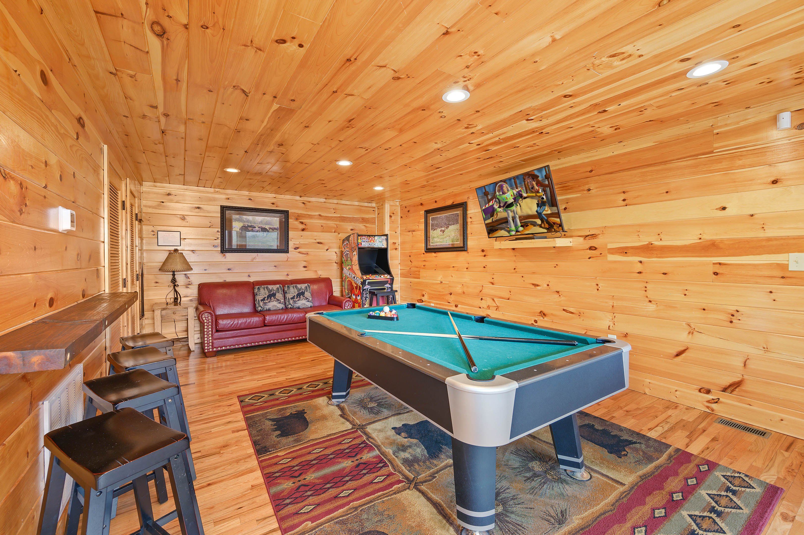 Lower level game room: Pool table and 2 multi-cade arcade games