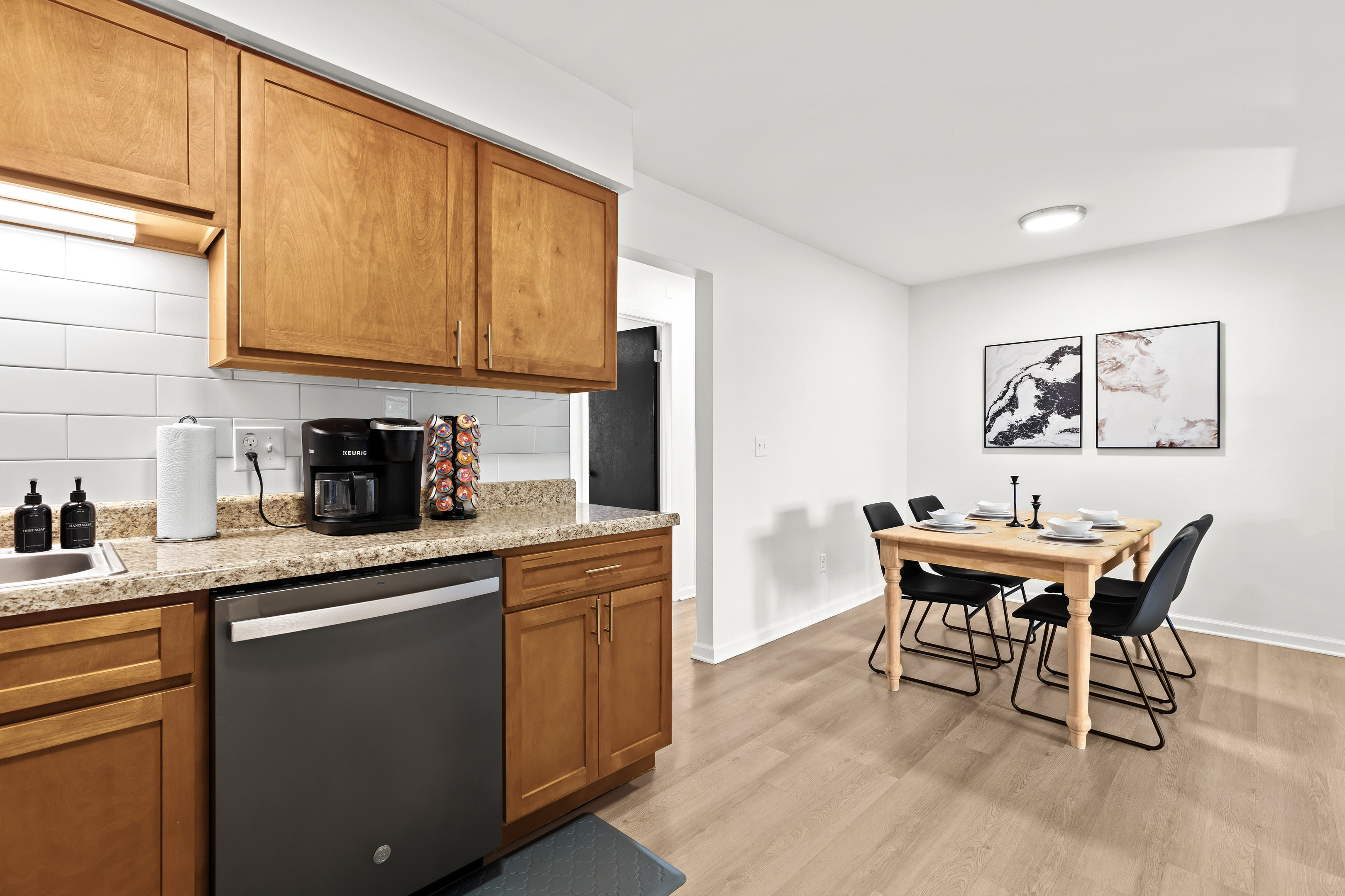 Dine in style at this intimate table set for four, conveniently close to the kitchen.
