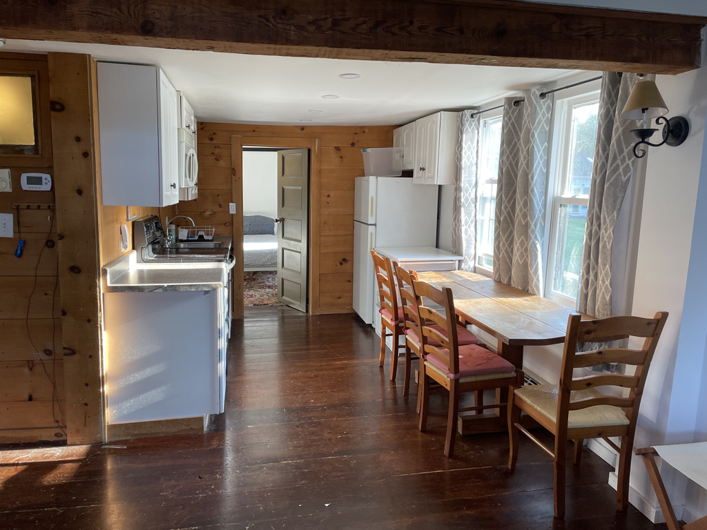 Kitchen into bedroom 1 of 2 bedroom barn apt