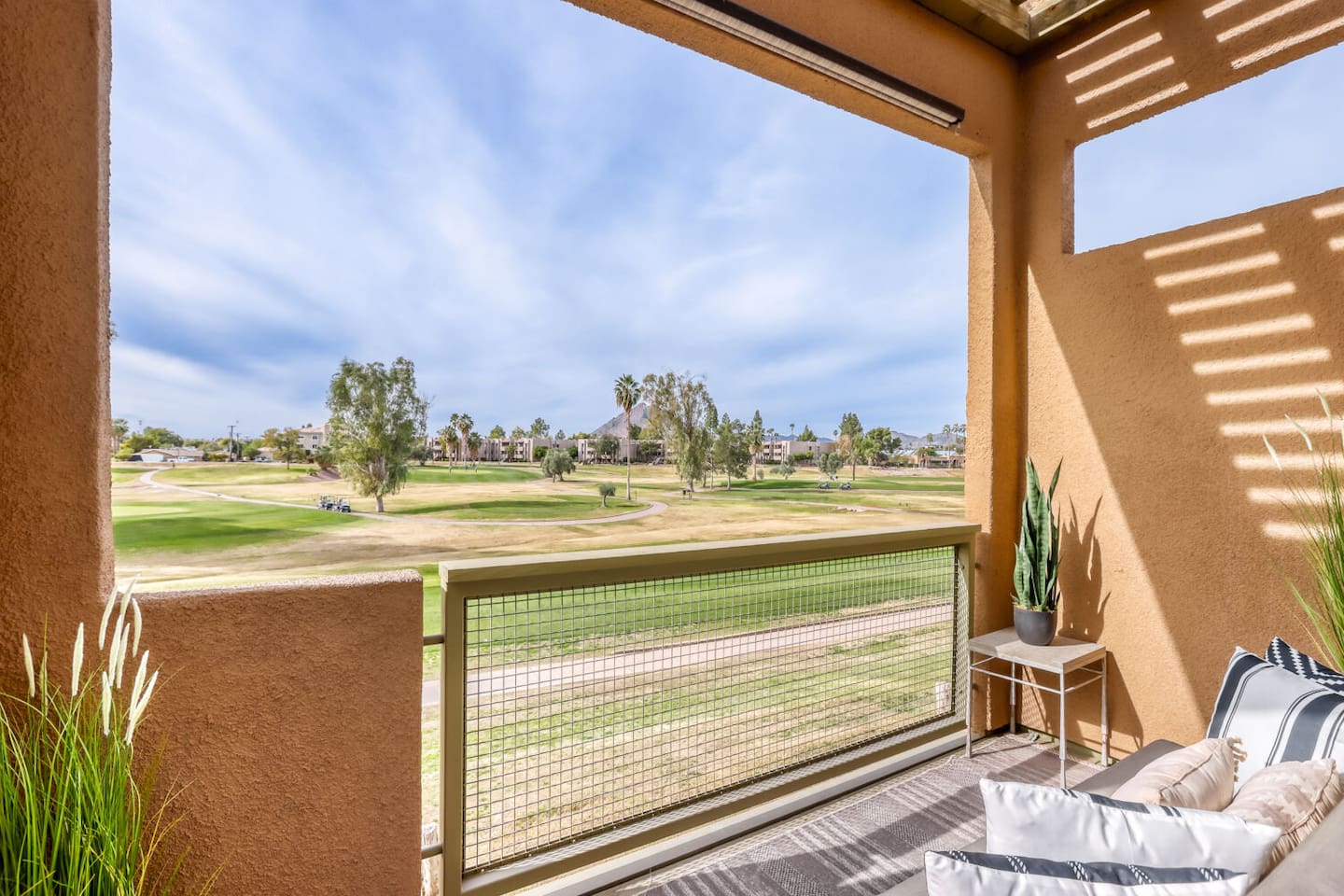 Step outside to sweeping green views and desert peaks in the distance — the perfect coffee spot.