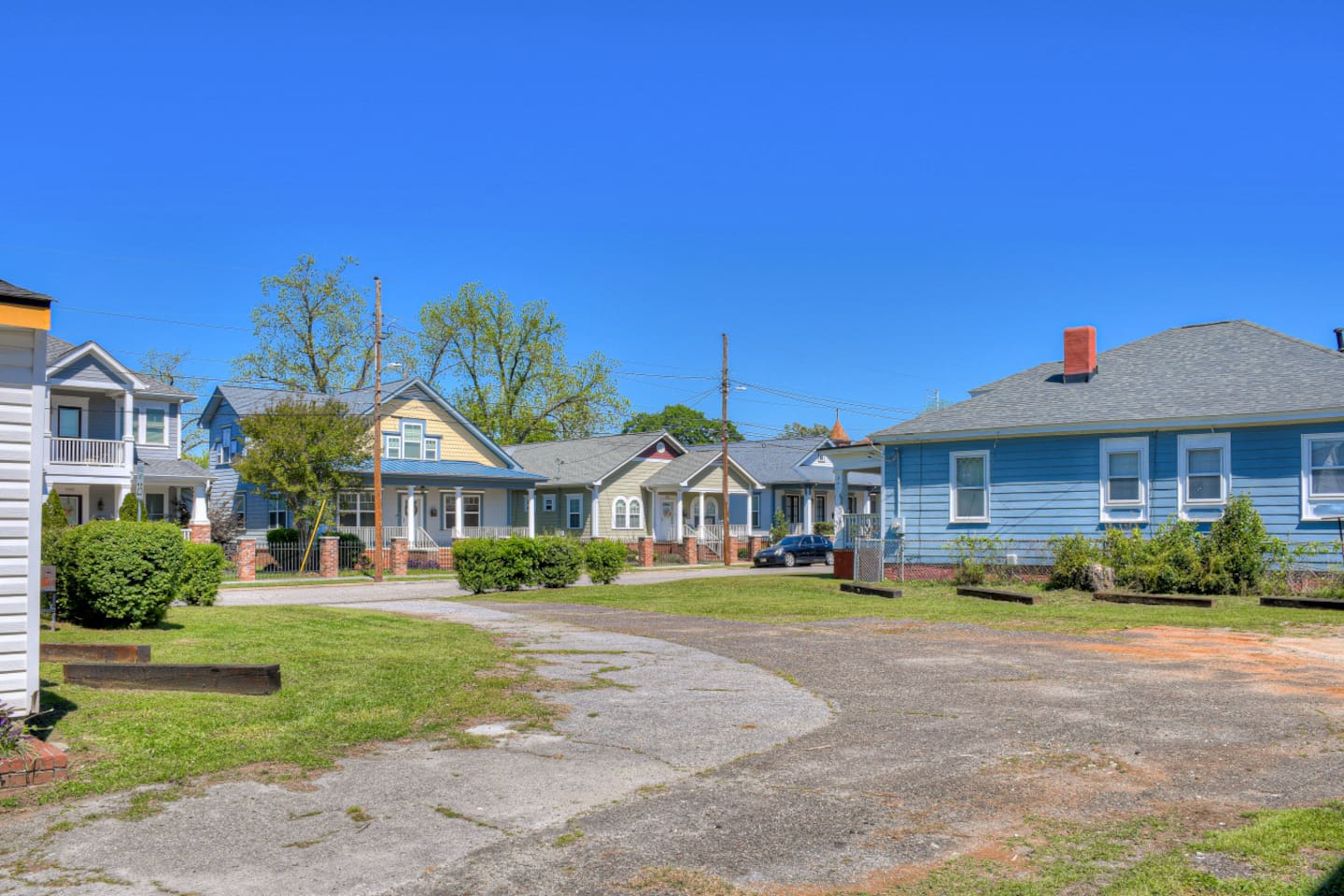 Expansive lot with multiple structures and open space.