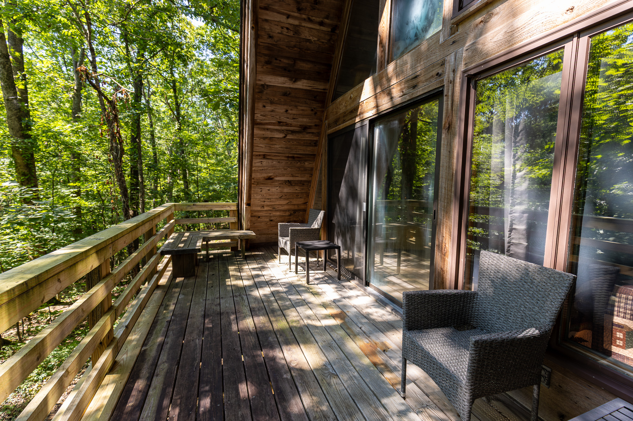 Gaze down at dense treetops from seating on the balcony.