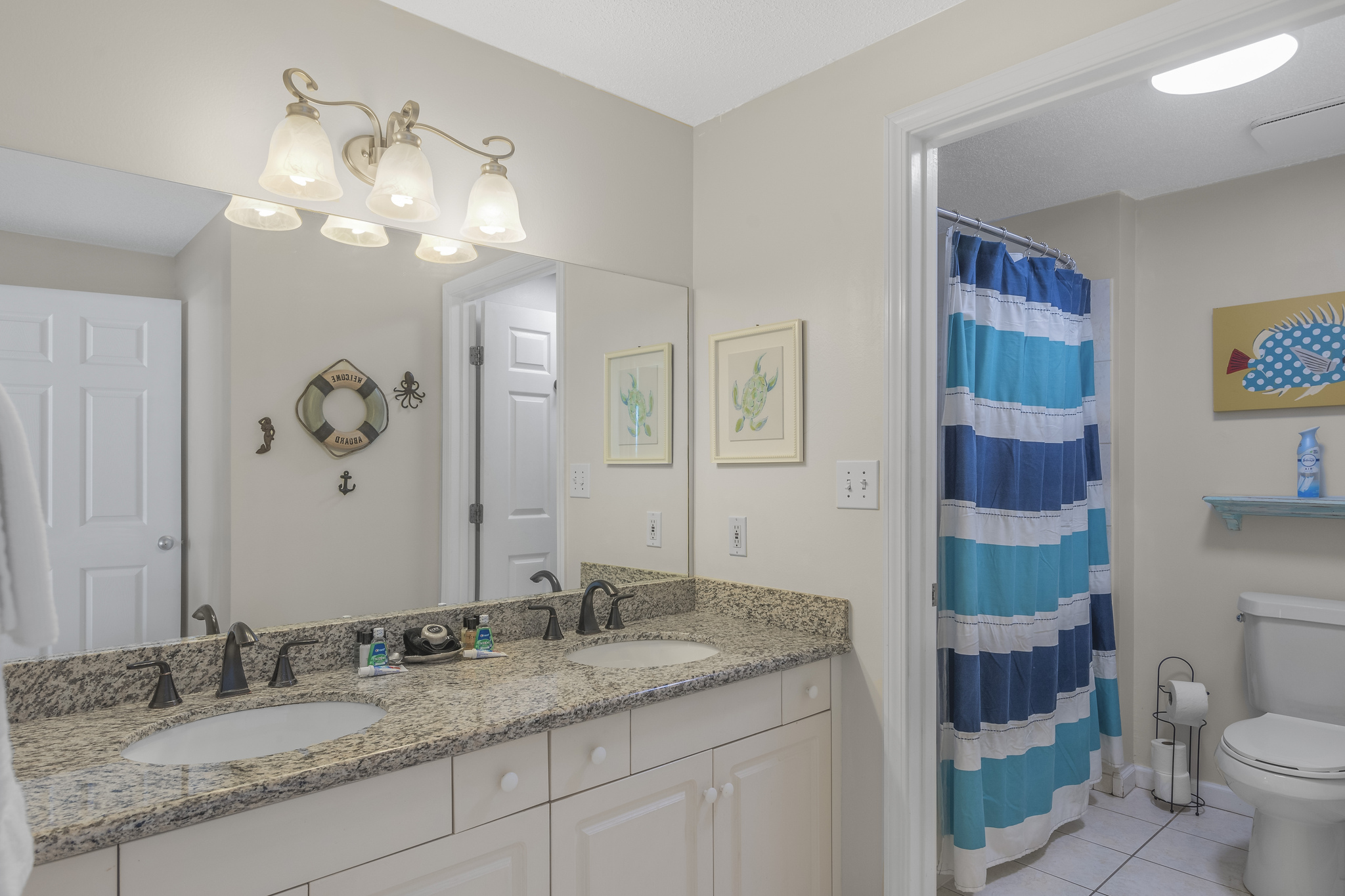 Master bathroom has granite countertops, dual vanities, and shower/tub combo