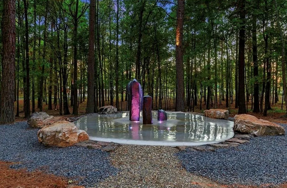 Unique outdoor community splash feature adding fun and relaxation to the forest setting