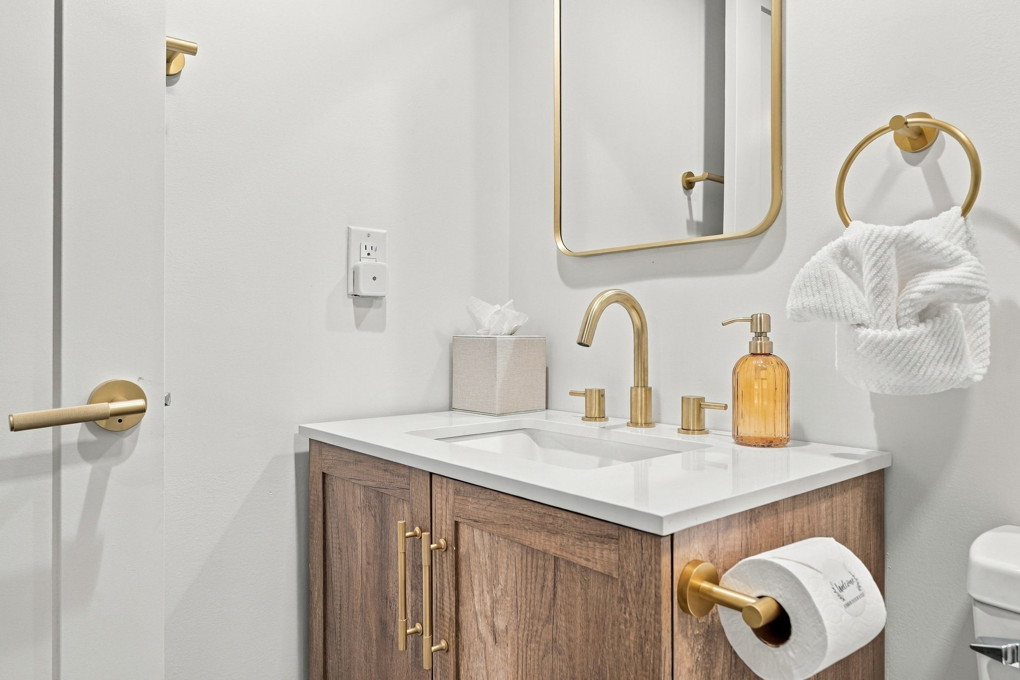 Bathroom Bliss: Elegant fixtures and a bright mirror make this space a refreshing retreat!