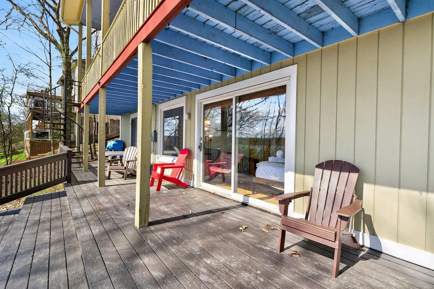 “Step onto the downstairs balcony—your private escape to unwind, sip coffee, and enjoy peaceful views with direct access to the outdoor deck below.”