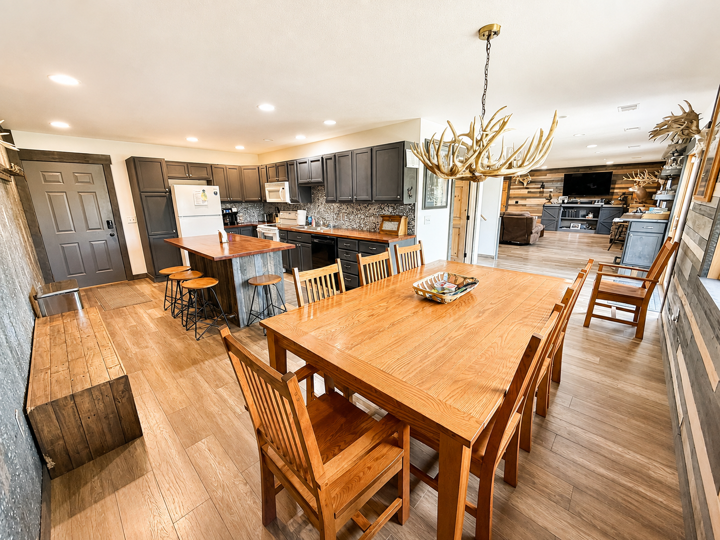 Large open kitchen and dining area designed for group stays, with generous seating and room for everyone to cook, eat, visit, and spend time together under one roof.